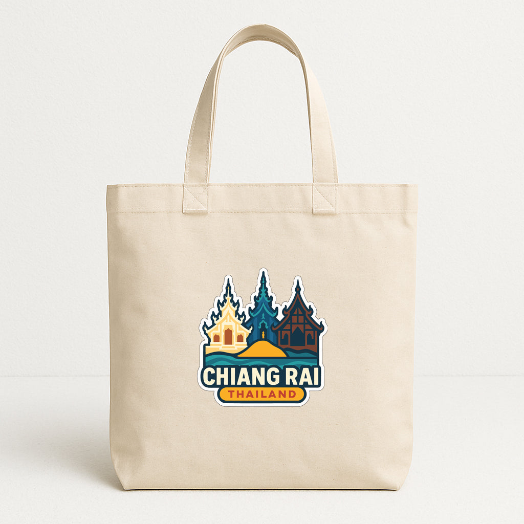 A beige tote bag with a printed design featuring a temple and the text "CHIANG RAI THAILAND".