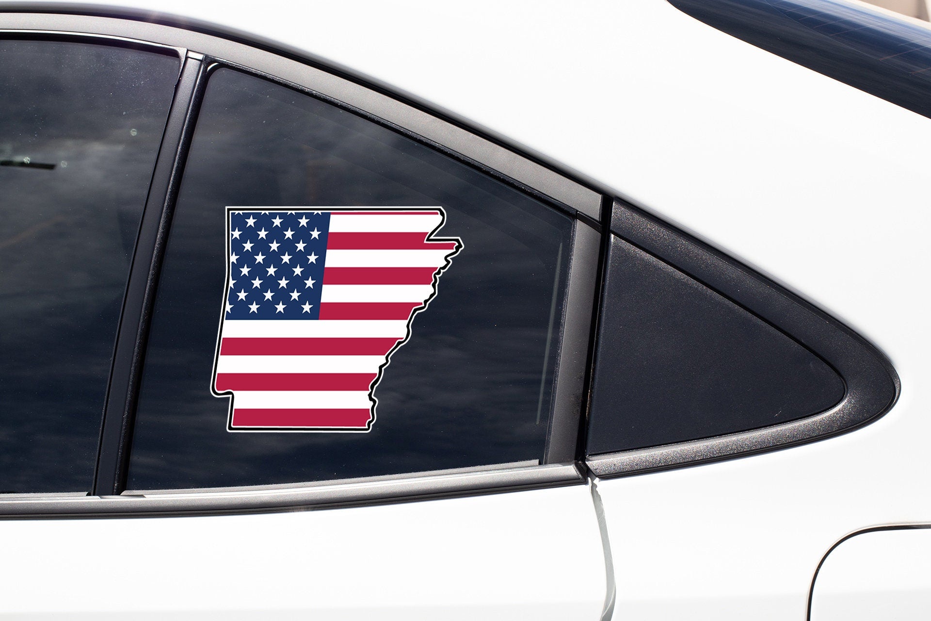 a car with a sticker of the state of wisconsin