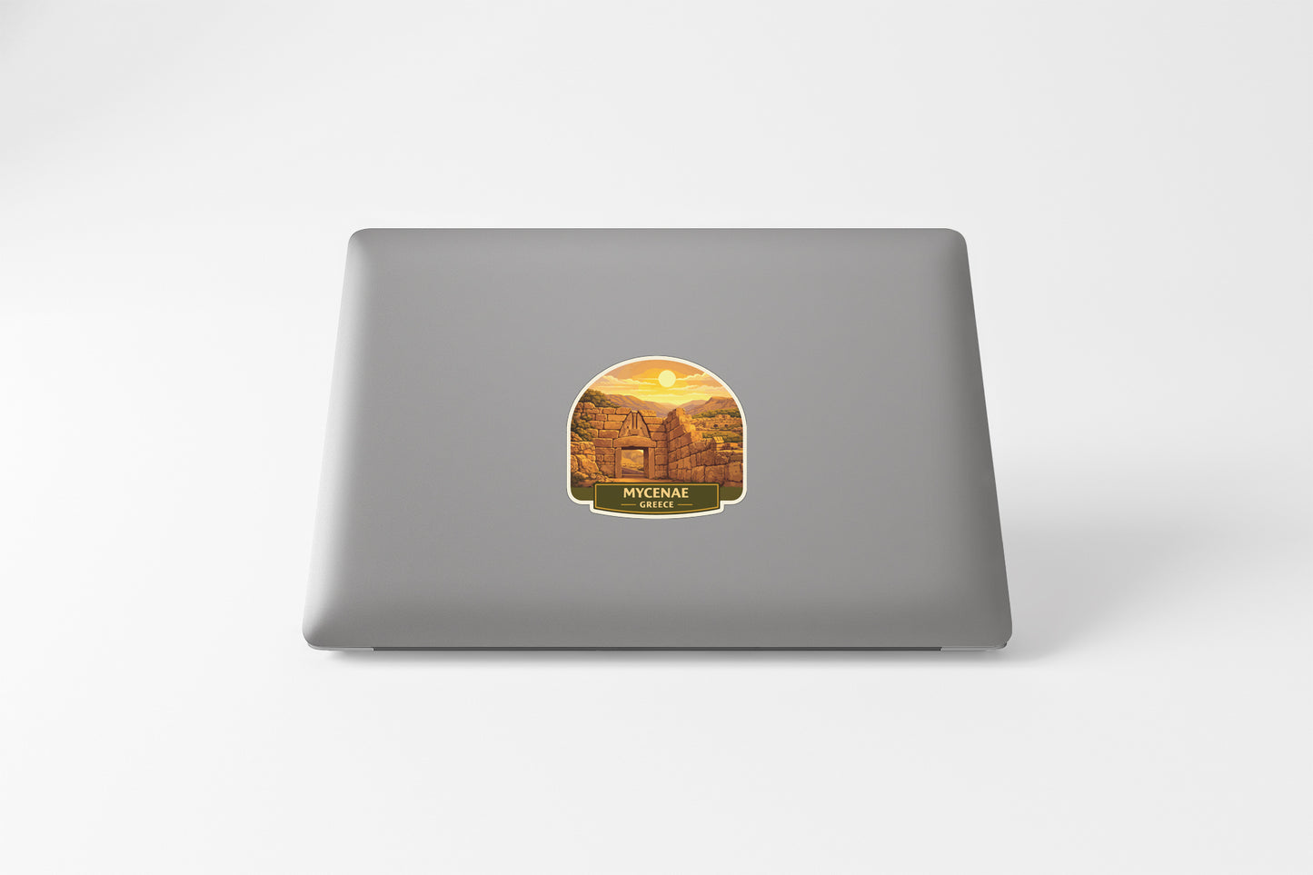 a sticker with a scenic view of a temple or building, likely in Cambodia, with a sunset in the background.