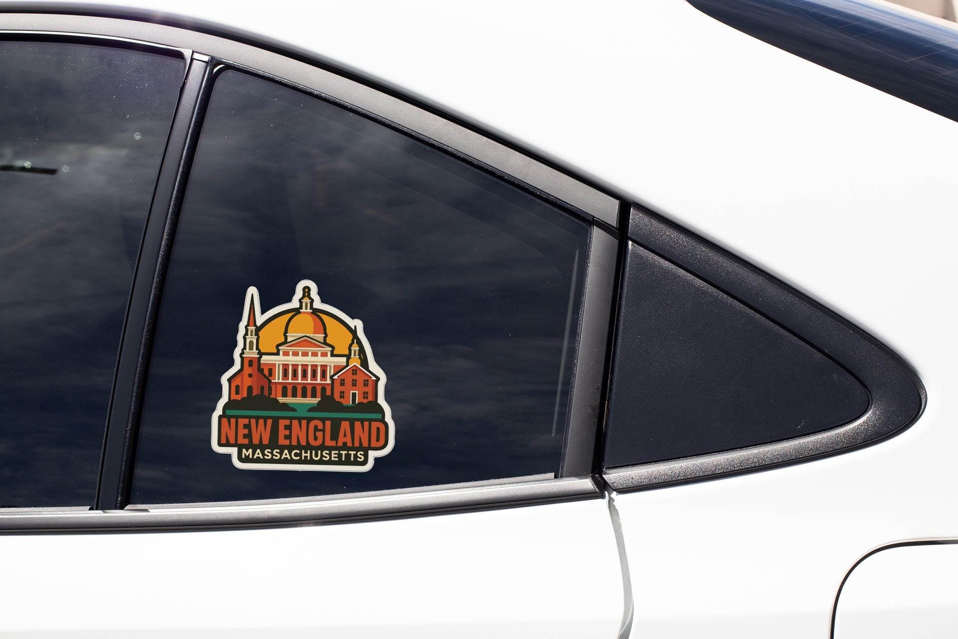 A sticker on the side of a car window, depicting a building with a dome and the text "NEW ENGLAND MASSACHUSETTS".