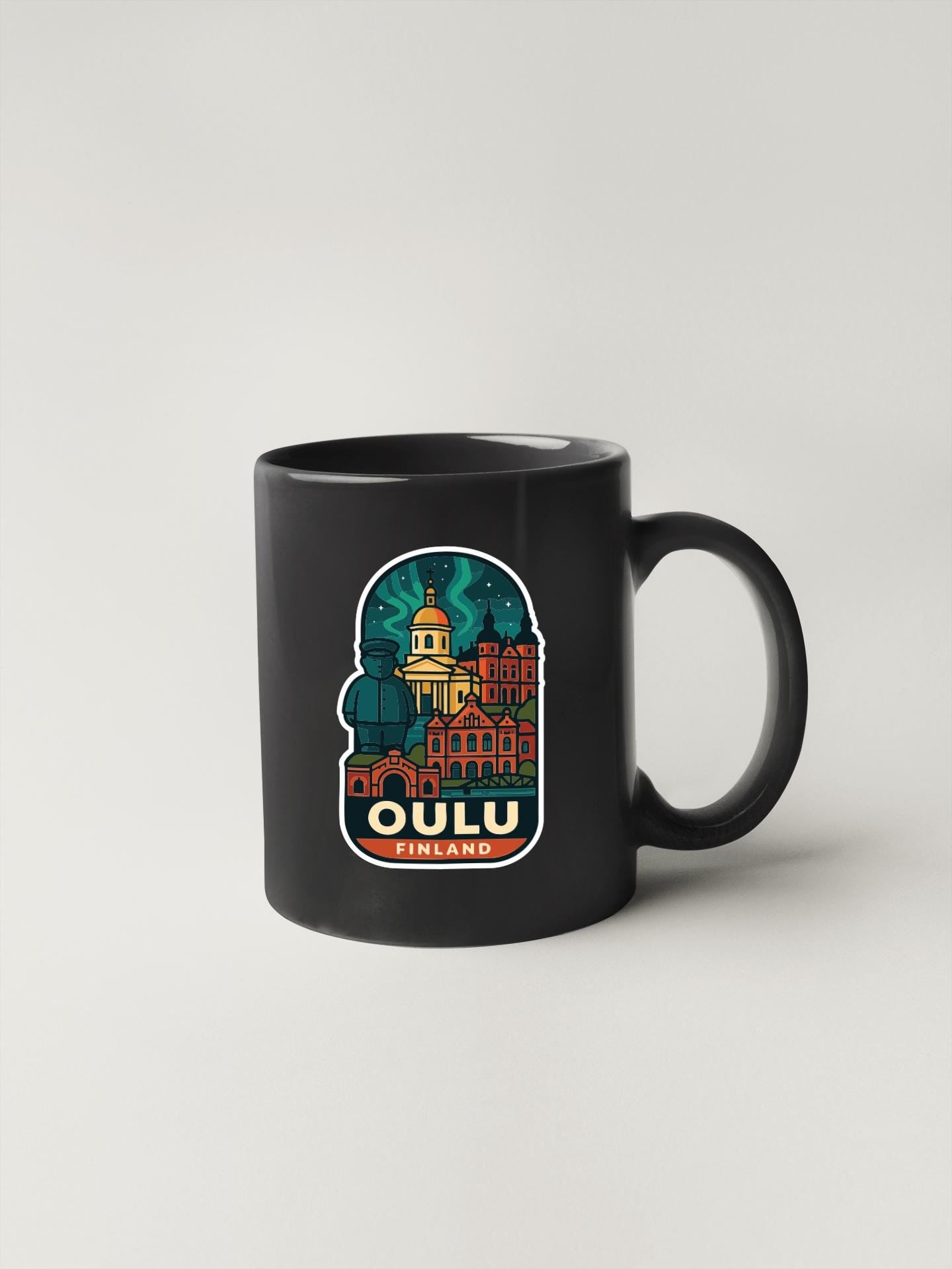 A black coffee mug with a colorful illustration of a city skyline and the text "OULU FINLAND" printed on it.