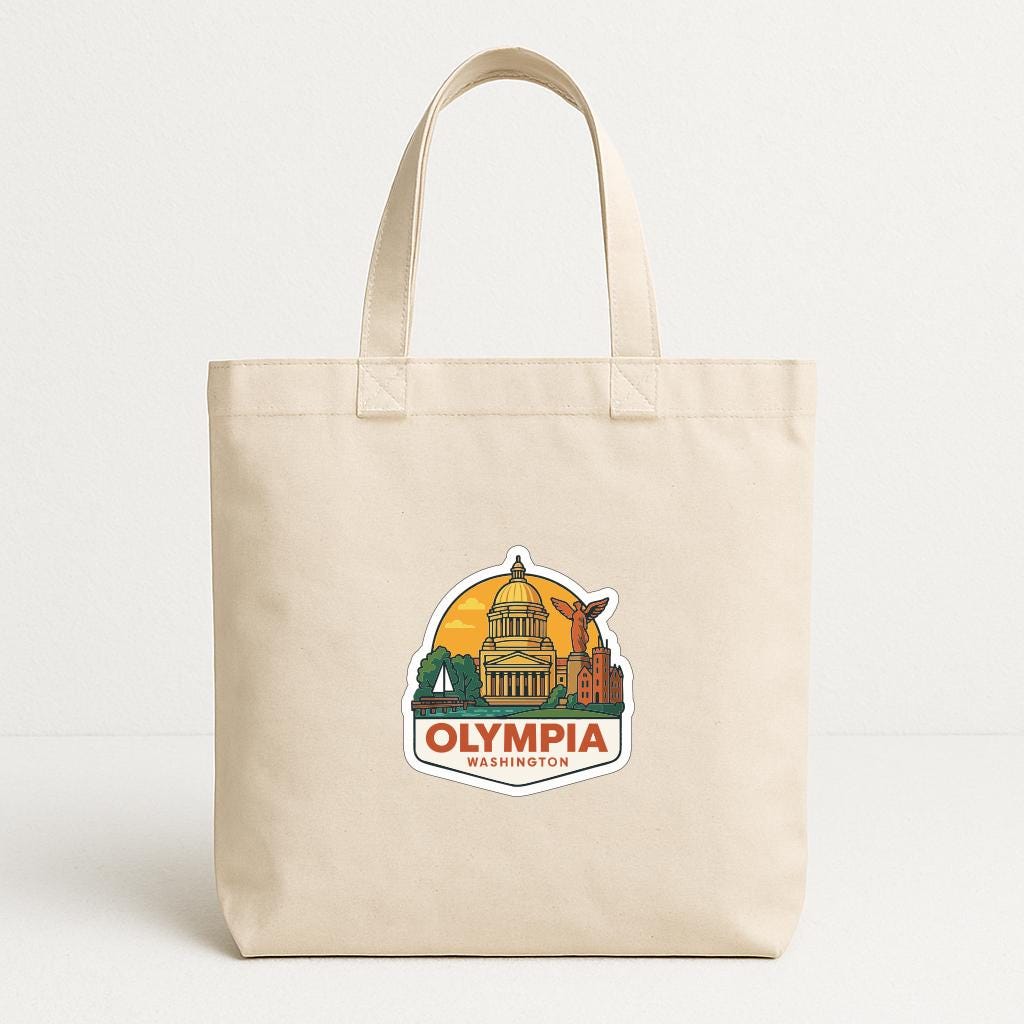 A beige tote bag with a sticker depicting the Washington State Capitol building and the text "OLYMPIA WASHINGTON" printed on it.