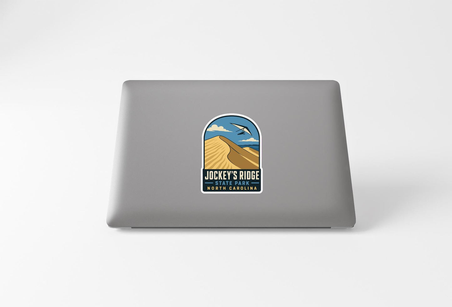 a sticker on the back of a laptop that says "JACKY'S RIDE THE PARKLANE NORTH CAROLINA".