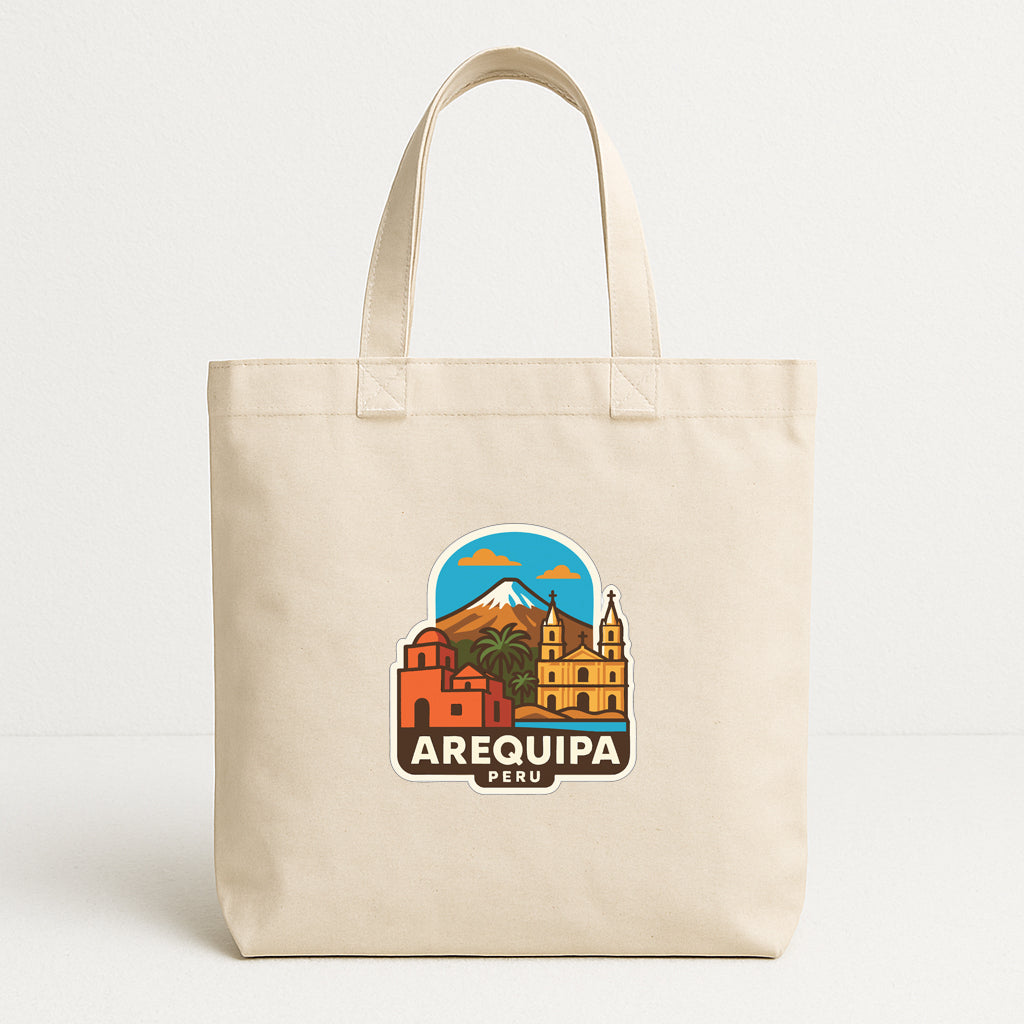 A beige tote bag with a printed design featuring the city of Arequipa, Peru.