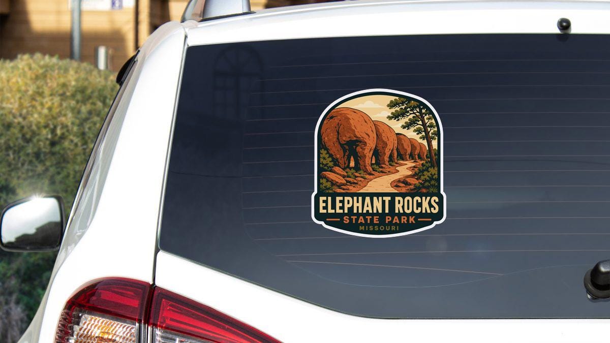 a sticker on the rear window of a car that says "Elephant Rocks State Park Missouri".