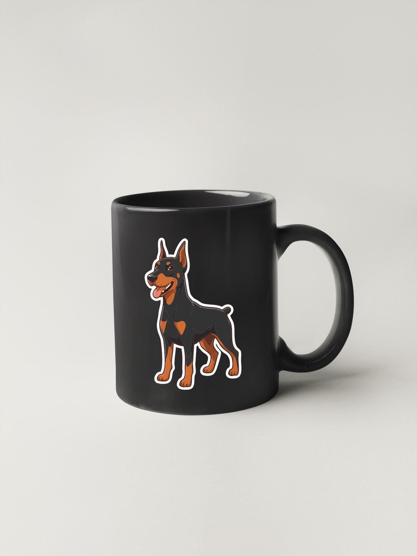 A black coffee mug with a cartoon illustration of a dog on it.