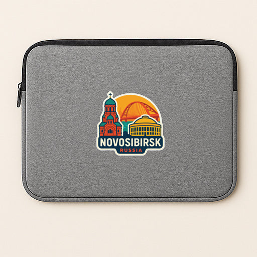 a gray laptop sleeve with a colorful sticker depicting the city of Novosibirsk, Russia.