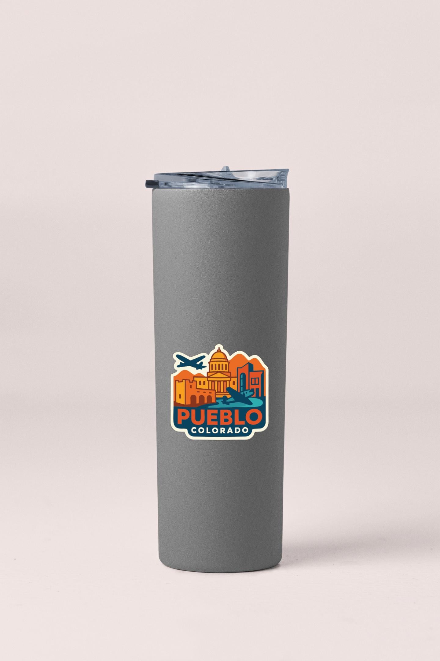 A gray insulated tumbler with a printed logo of Puerto Rico on it.