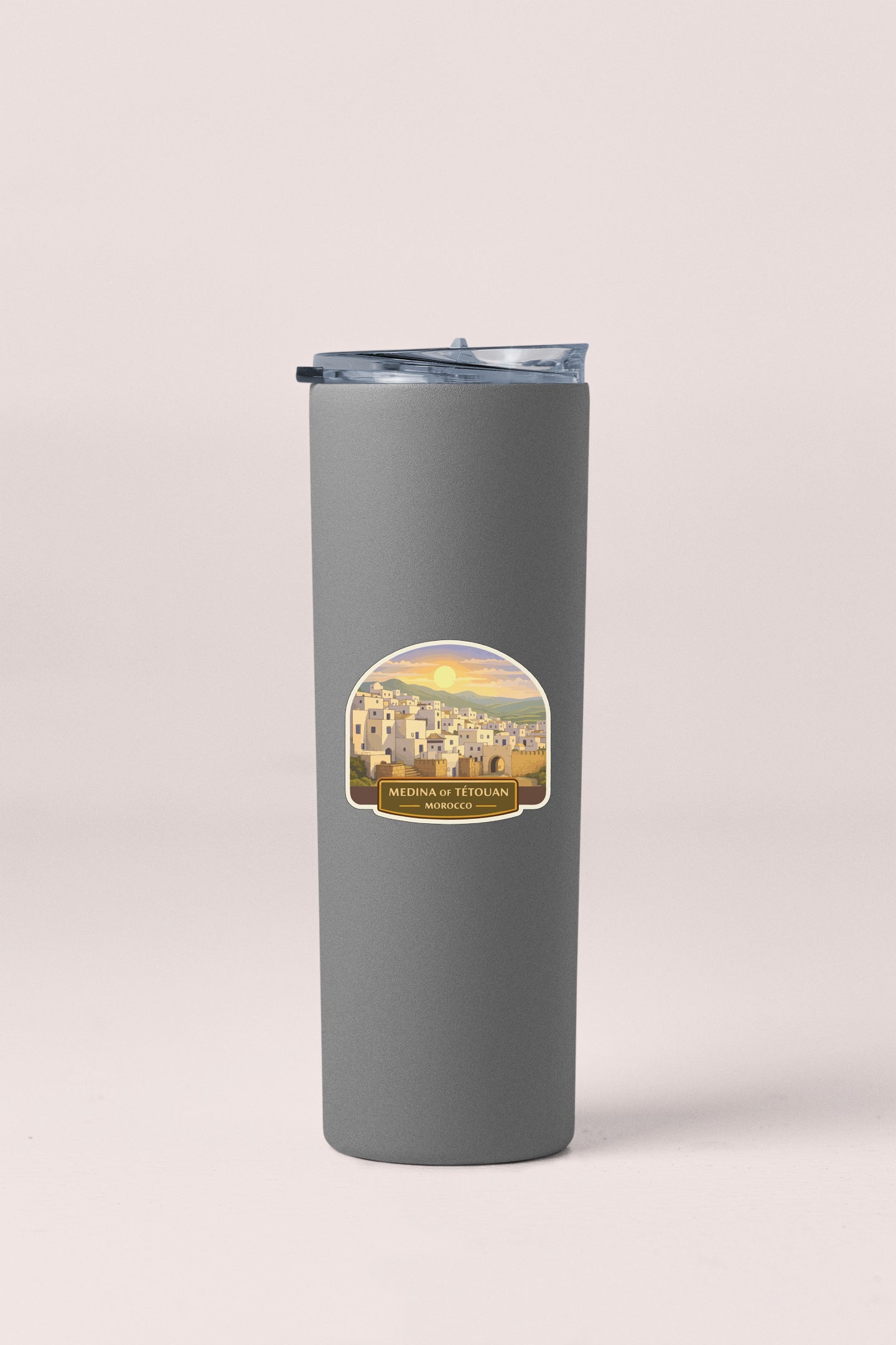 A gray insulated tumbler with a label depicting a cityscape and the text "MEDINA T'FOULAN" and "MOROCCO".