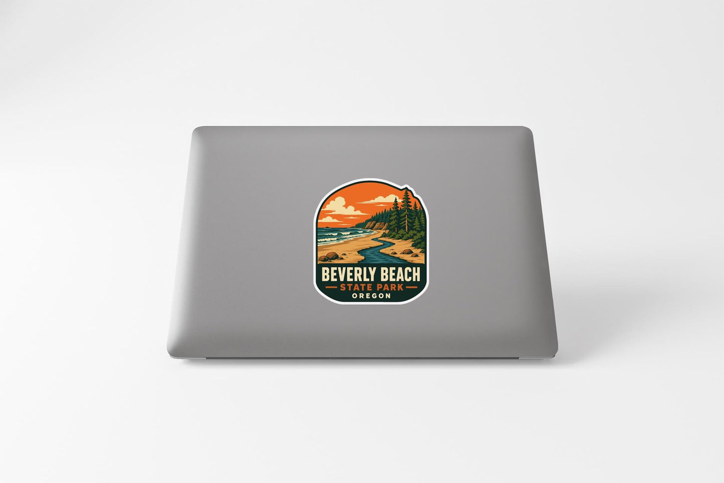 a sticker on the back of a laptop that says "BEVERLY BEACH STATE PARK OREGON".