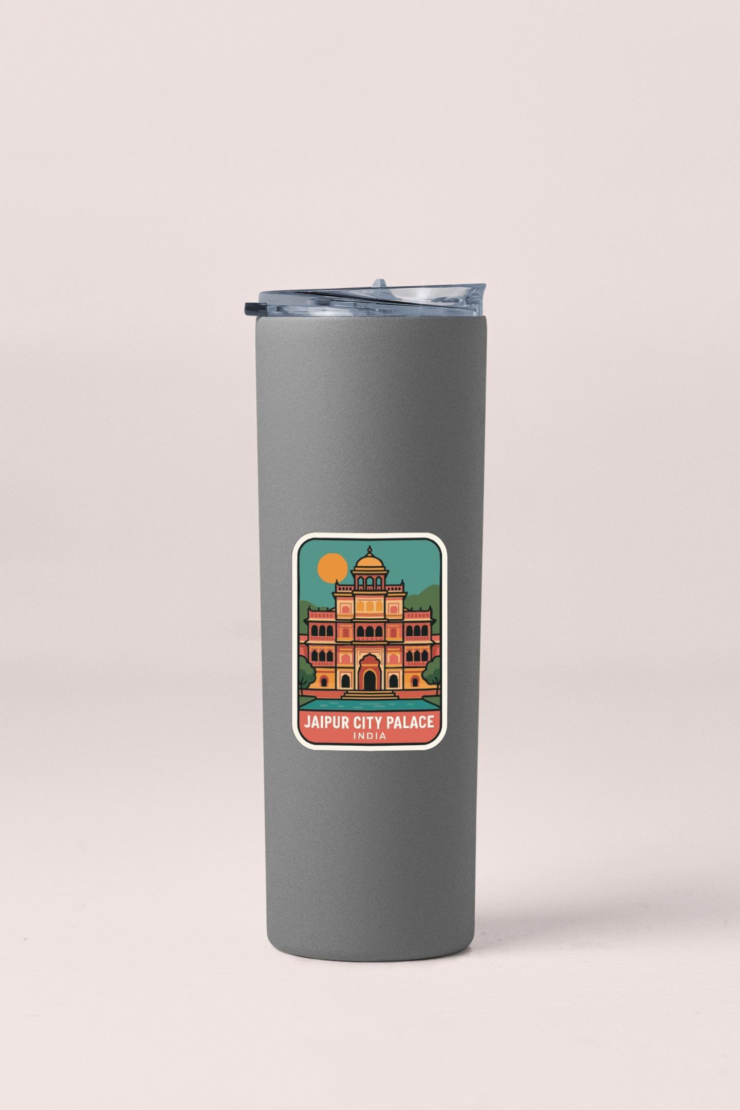 A gray insulated tumbler with a sticker depicting the Jaipur City Palace in India.