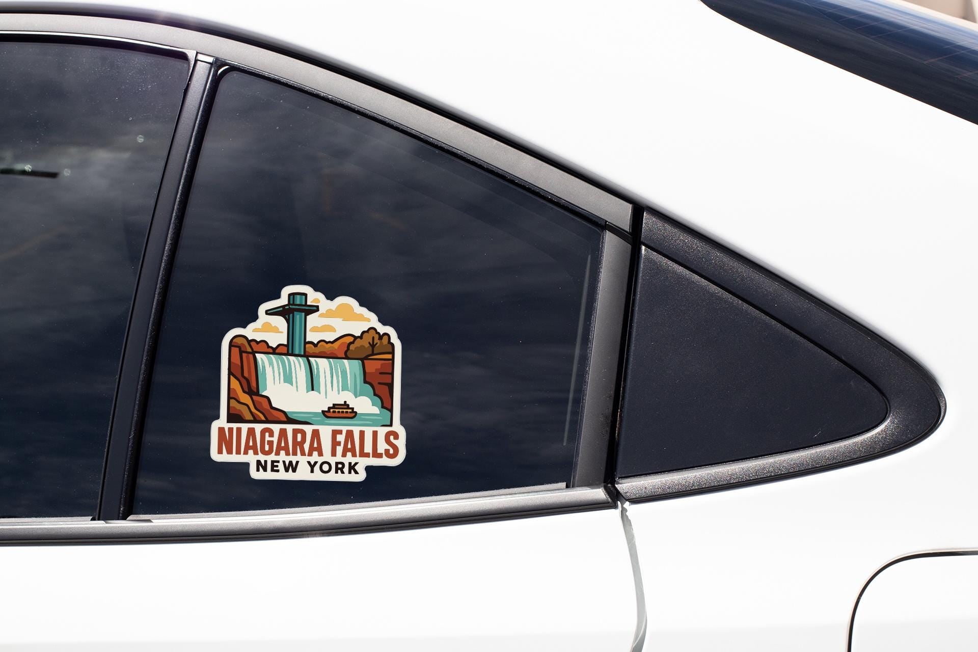 A sticker on the side of a car window that says " Niagara Falls New York".