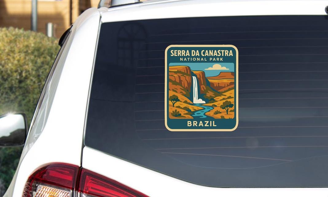 A sticker on the rear window of a car that says "SERRA DA CANASTRA NATIONAL PARK BRAZIL".