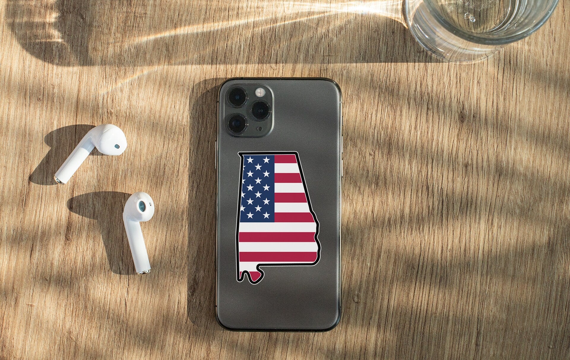 a cell phone with a sticker of the state of california on it