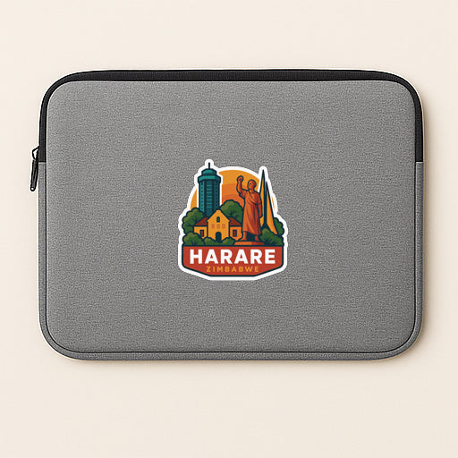 A gray laptop sleeve with a sticker featuring an illustration of a city skyline and the word "HARARE" printed on it.