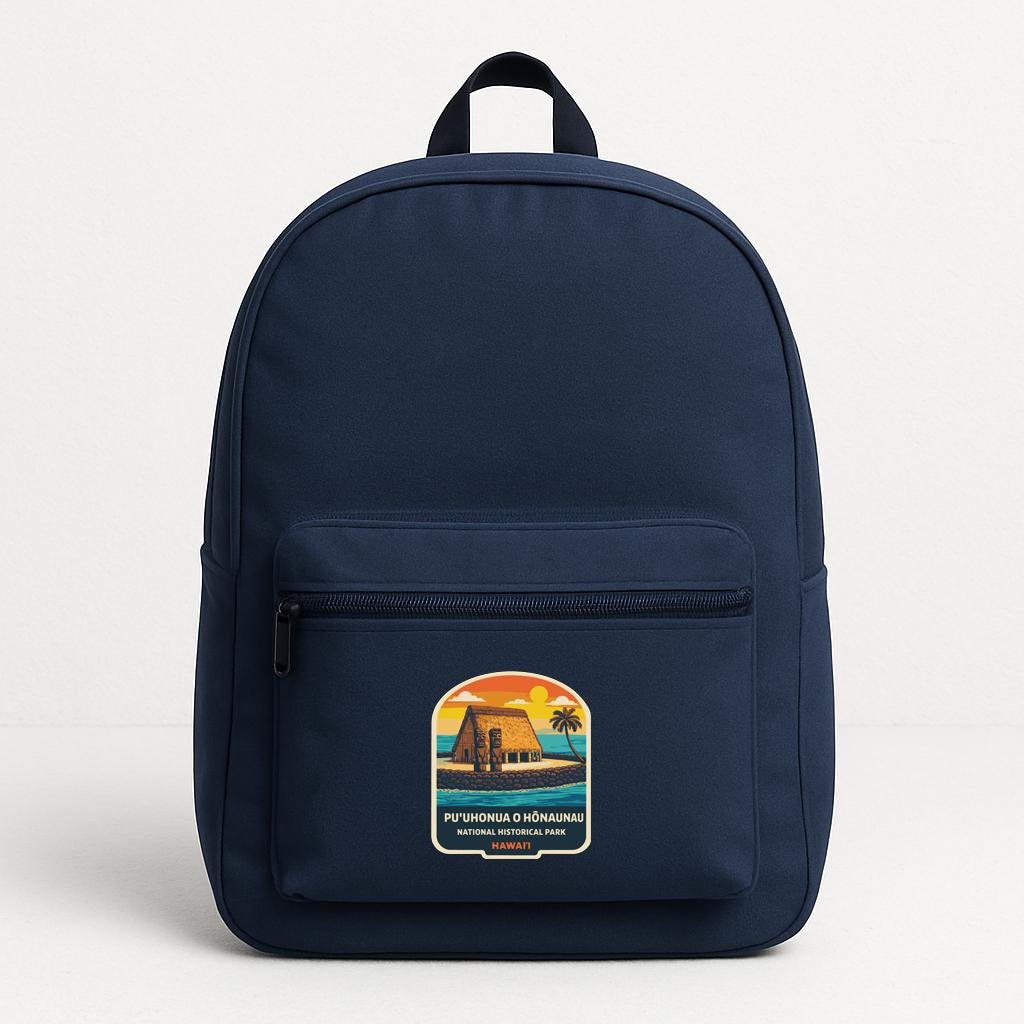 A navy blue backpack with a graphic on the front pocket.