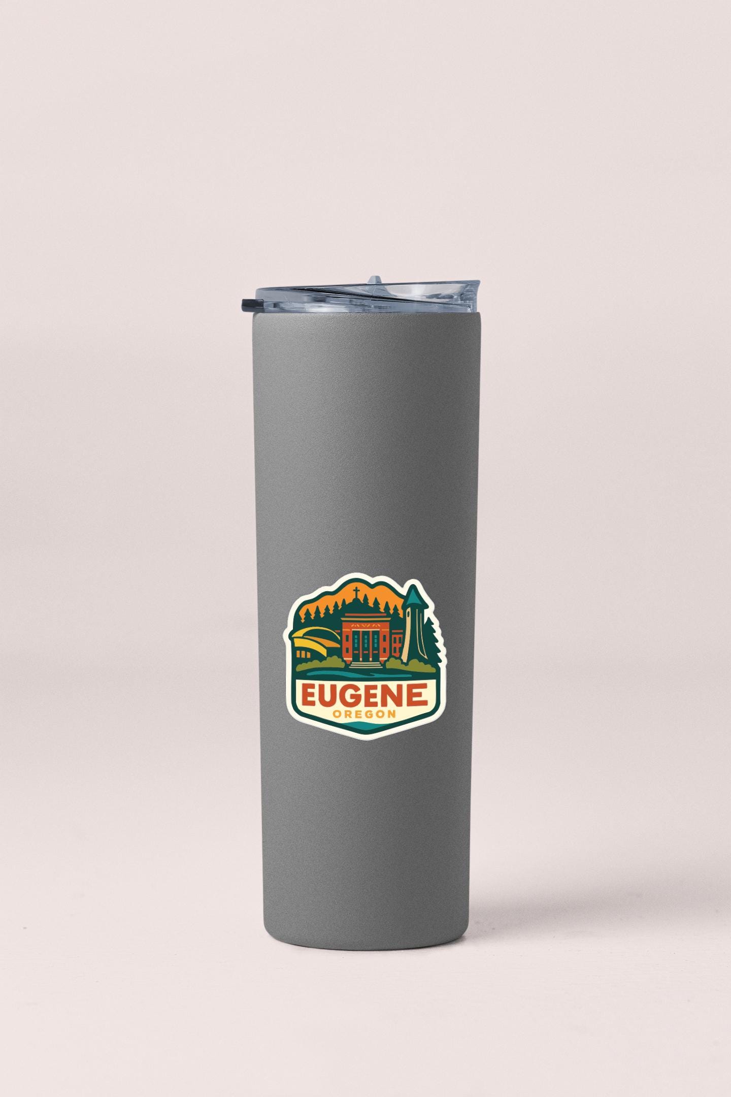 A gray insulated tumbler with a lid and a logo on it.