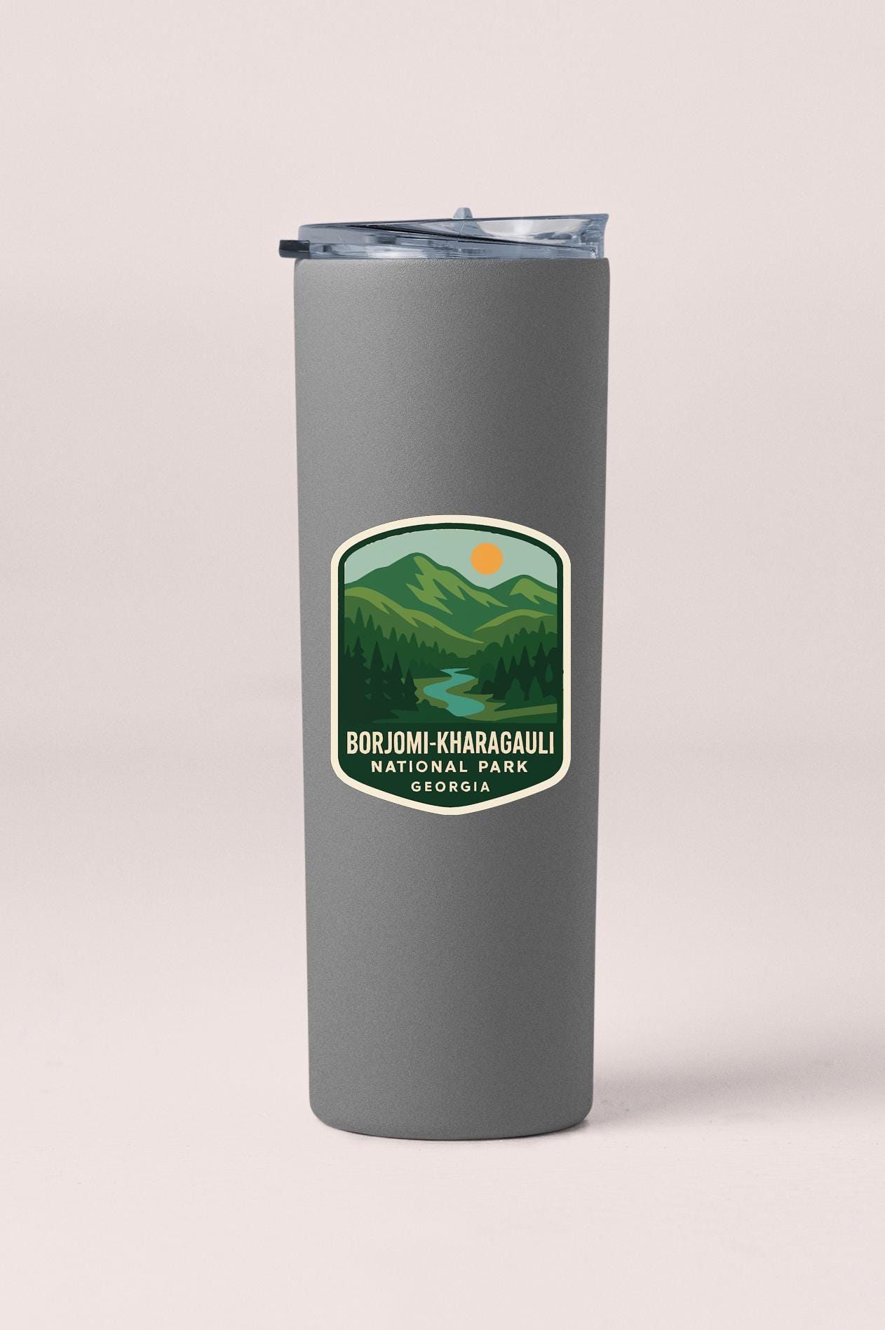 A gray insulated tumbler with a label that says "BORJOMI-KHARAGULI NATIONAL PARK GEORGIA".