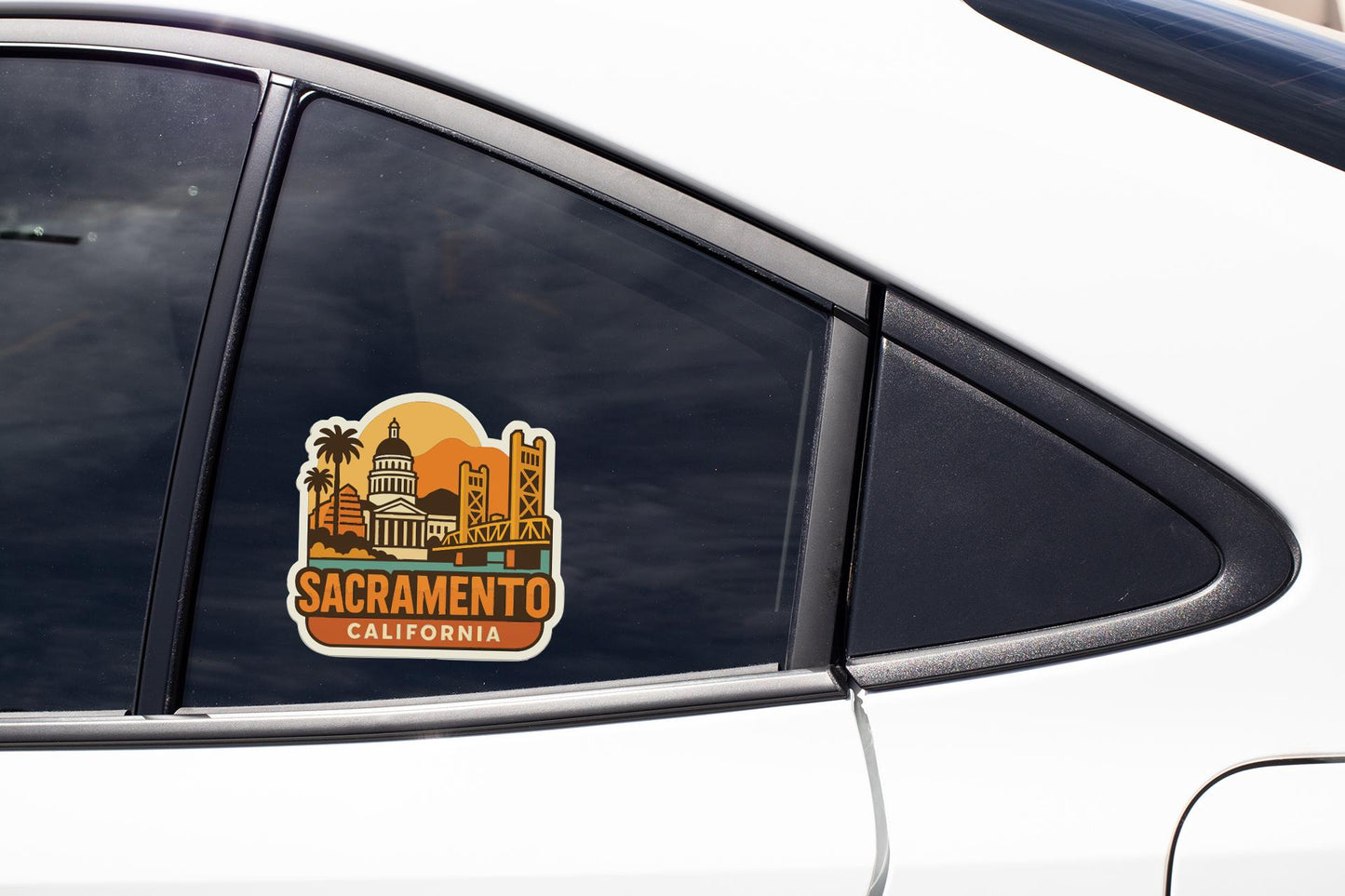 A sticker on the side of a car window, depicting the Sacramento, California skyline.