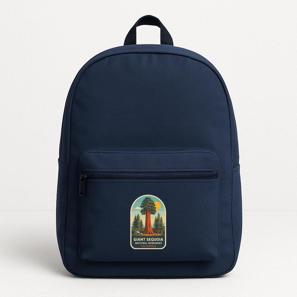A navy blue backpack with a graphic of a giant sequoia tree on the front pocket.