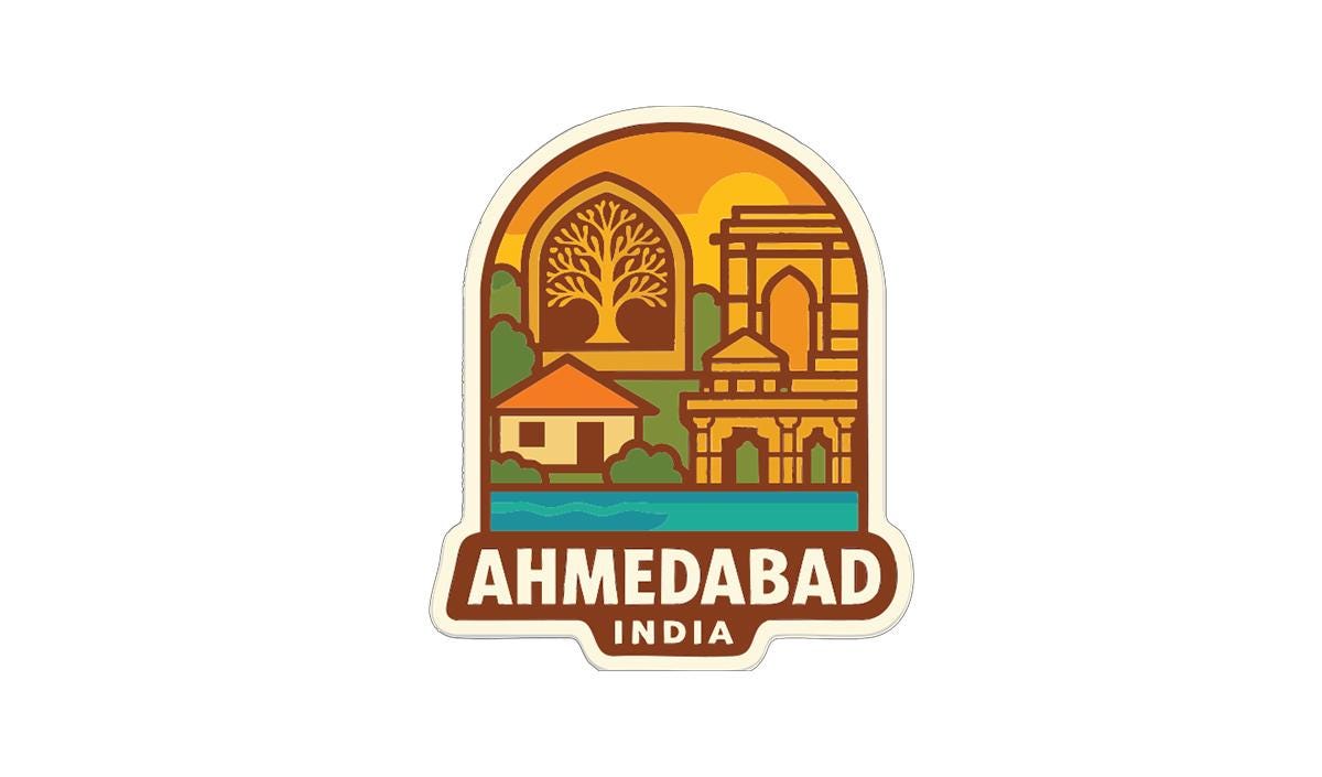 a sticker or emblem with a stylized illustration of a cityscape, including a tree, buildings, and a body of water. The text "AHMEDABAD, INDIA" is prominently displayed below the illustration.