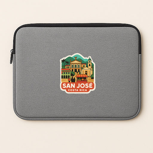 A gray laptop sleeve with a sticker depicting the city of San Jose, Costa Rica.