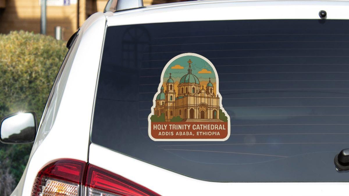 A sticker on the rear window of a car, depicting the Holy Trinity Cathedral in Addis Ababa, Ethiopia.
