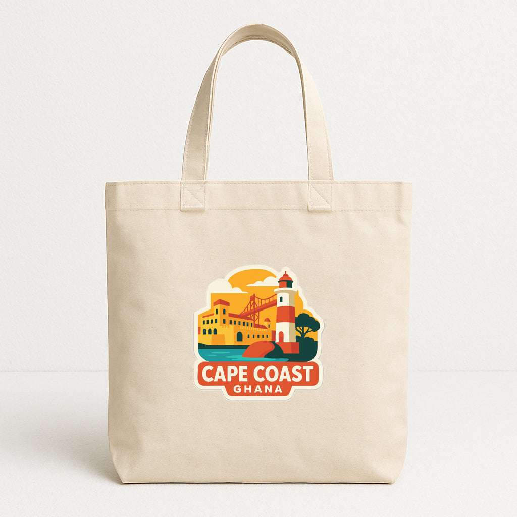 A beige tote bag with a graphic design depicting a lighthouse and buildings along with the text "CAPE COAST GHANA".
