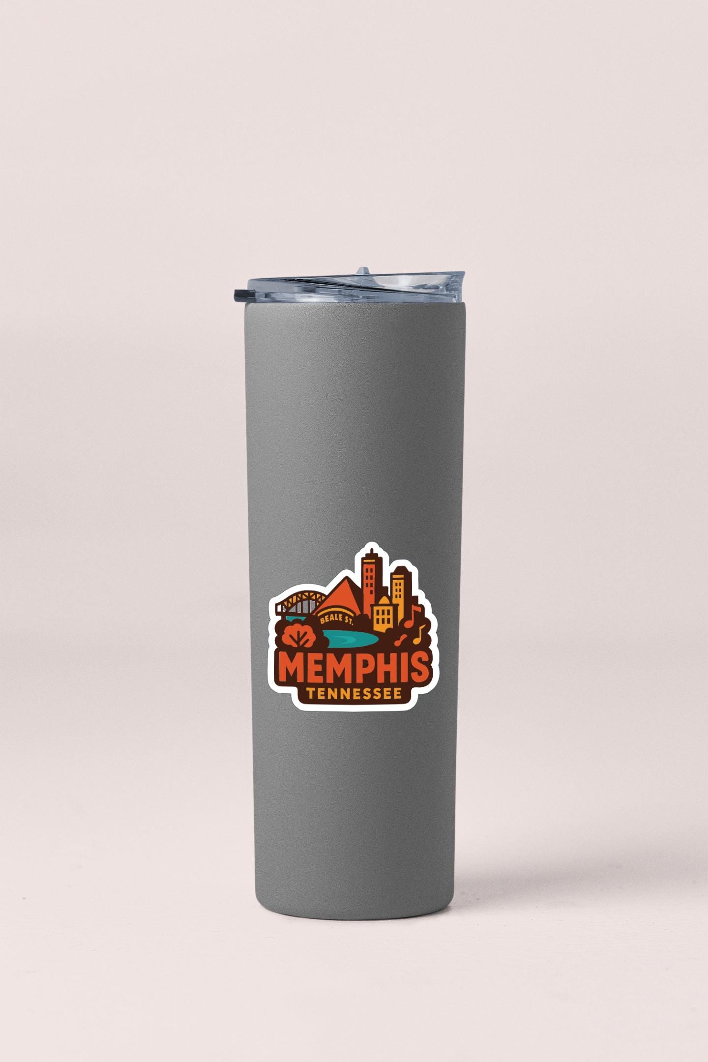 A gray insulated tumbler with a logo depicting the city of Memphis, Tennessee.