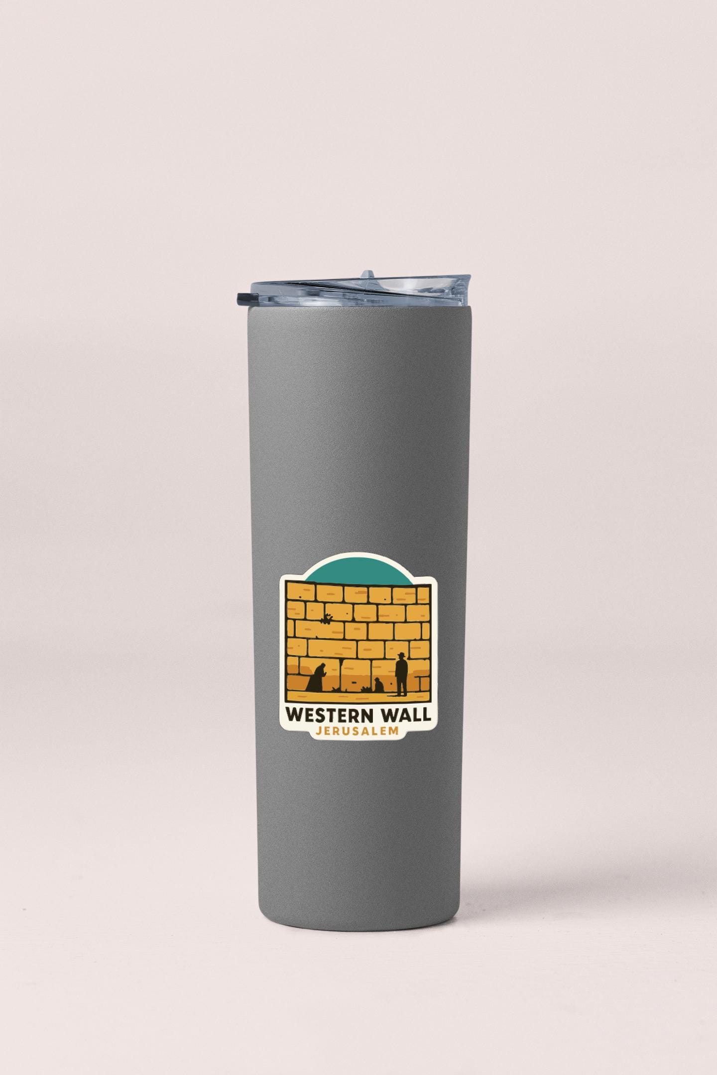 A gray insulated tumbler with a sticker on it.