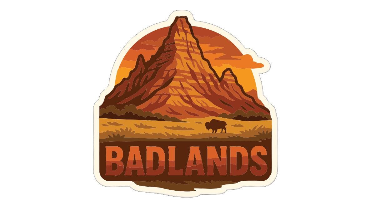 A sticker or label featuring a mountain landscape with a bison in the foreground, and the word "BADLANDS" written below.