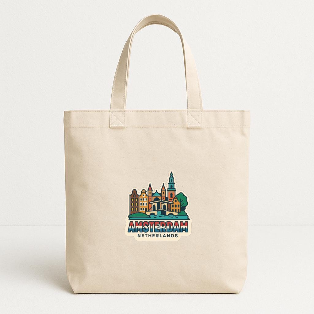 A beige tote bag with a printed design of Amsterdam, Netherlands, featuring a cityscape and landmarks.
