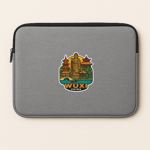 A gray laptop sleeve with a colorful sticker depicting a landmark in China.