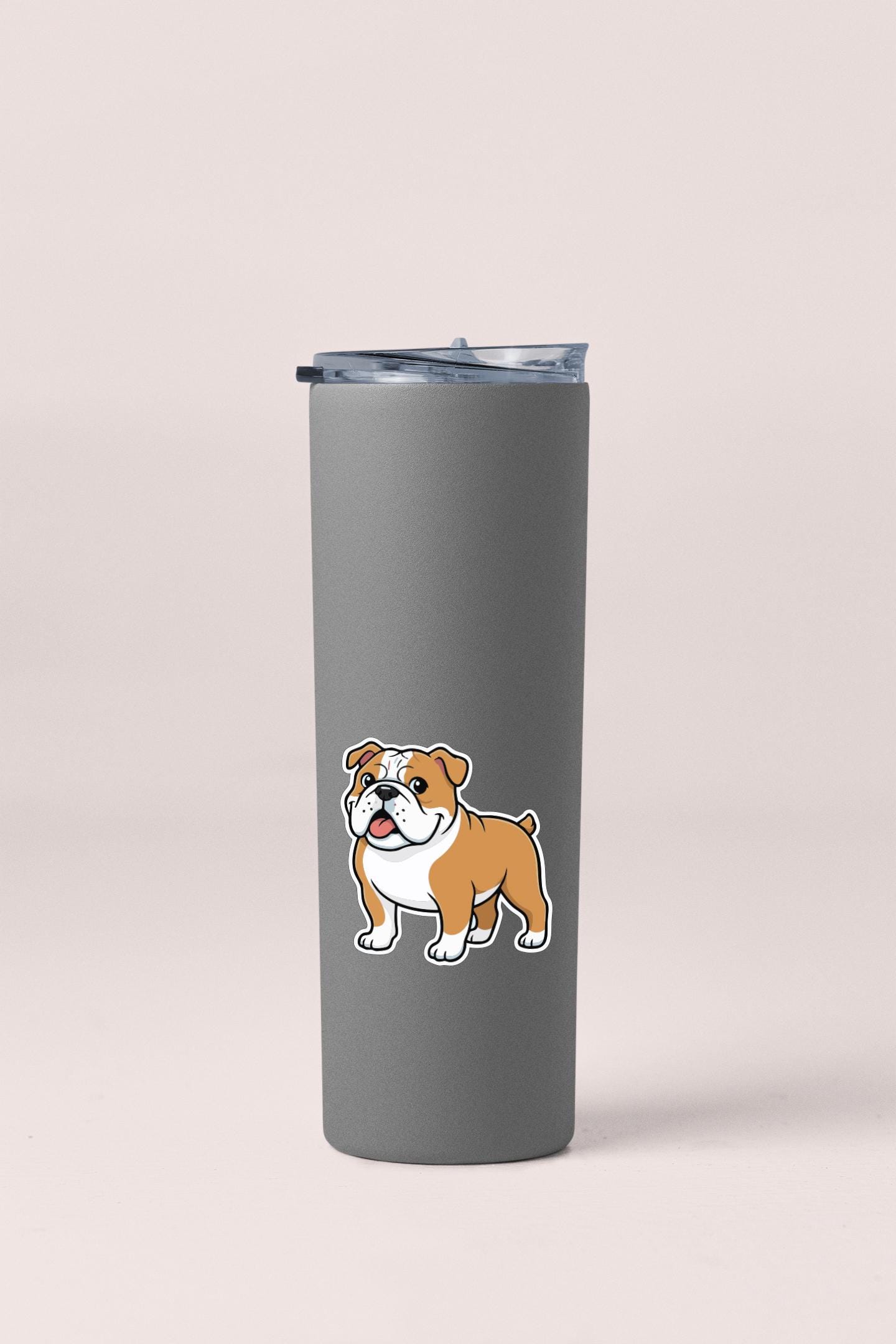 A gray insulated tumbler with a cartoon illustration of a bulldog on it.