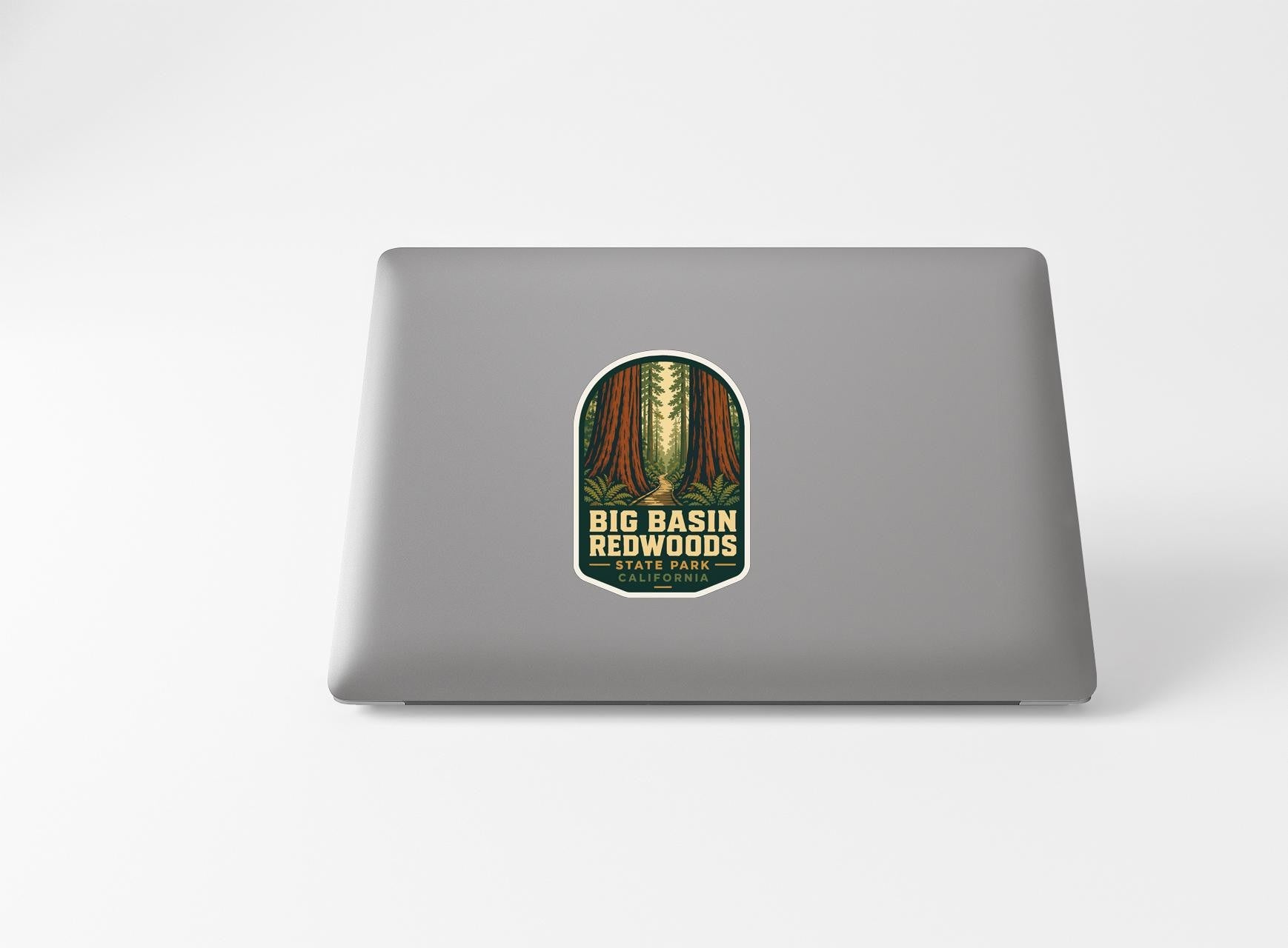 A sticker with the text "BIG BASIN REDWOODS" and "STATION PARK" printed on a laptop.