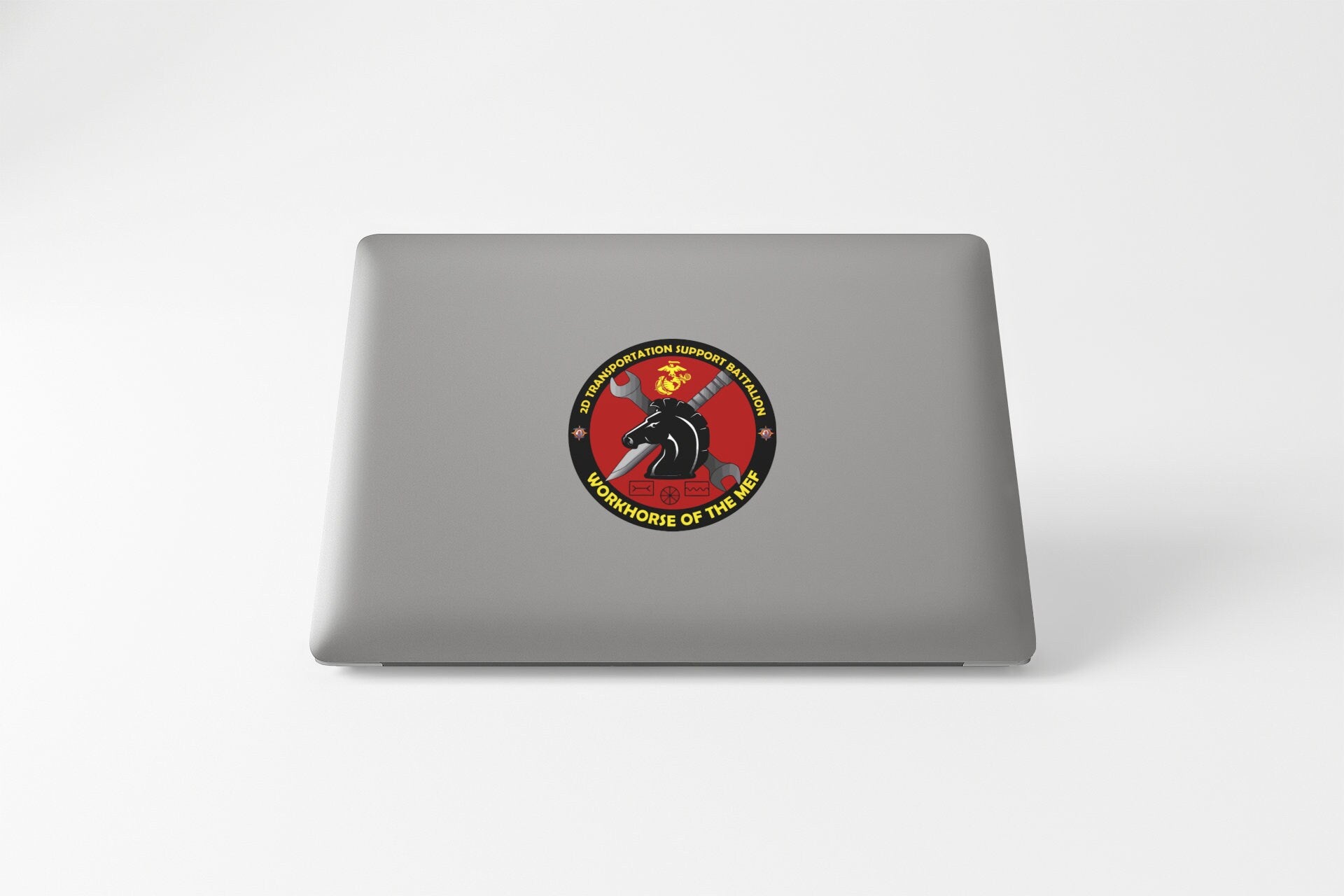 a laptop with a sticker of a horse on it