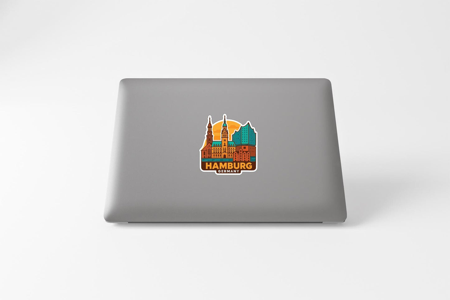 A sticker depicting the skyline of Hamburg, Germany, on the back of a laptop computer.