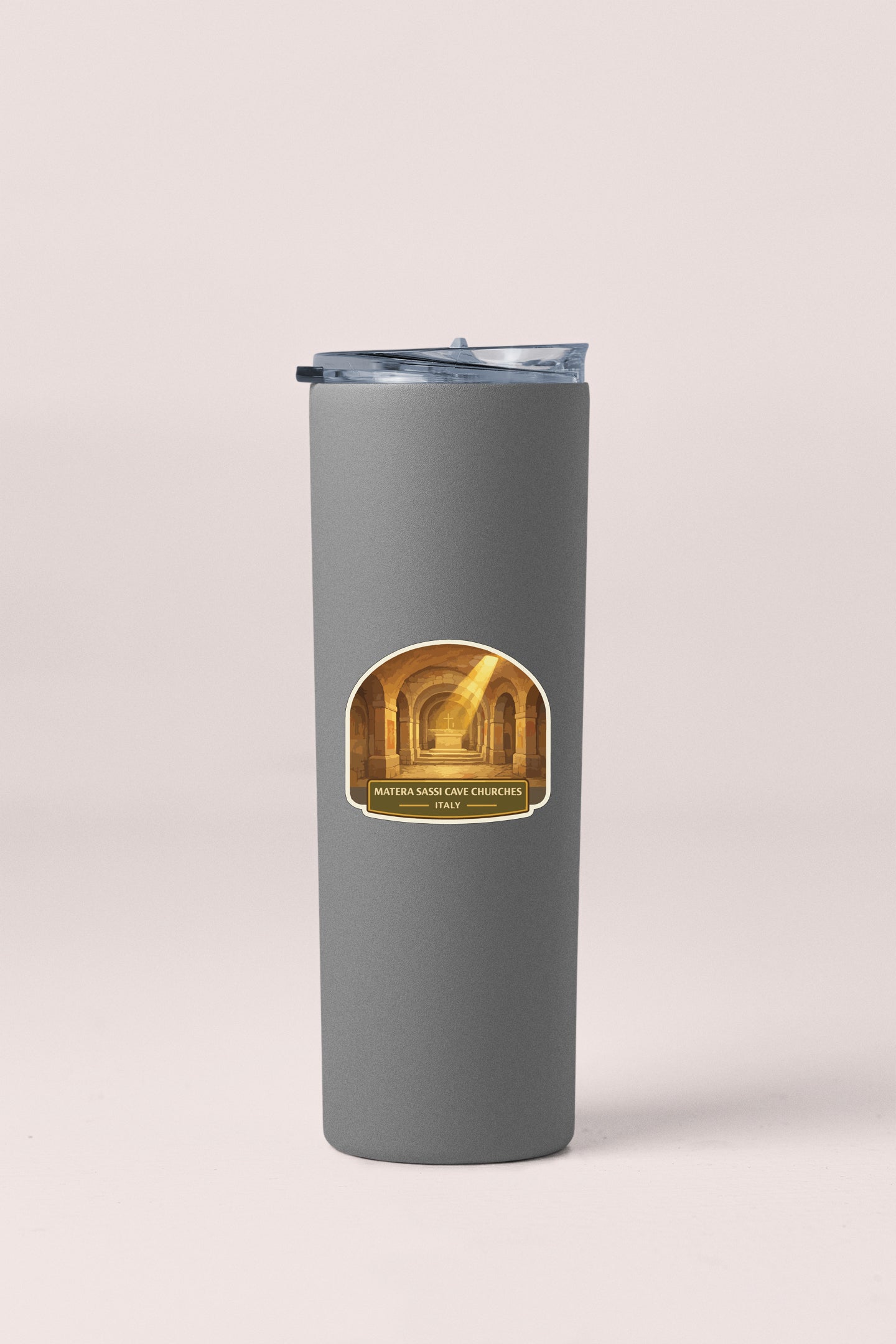 A gray cylindrical container with a lid and a label featuring an image of a hallway with a golden archway.
