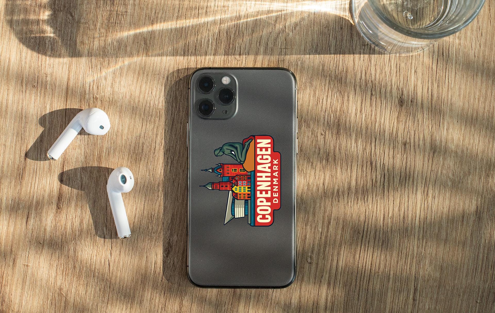 an iphone case sitting on top of a wooden table