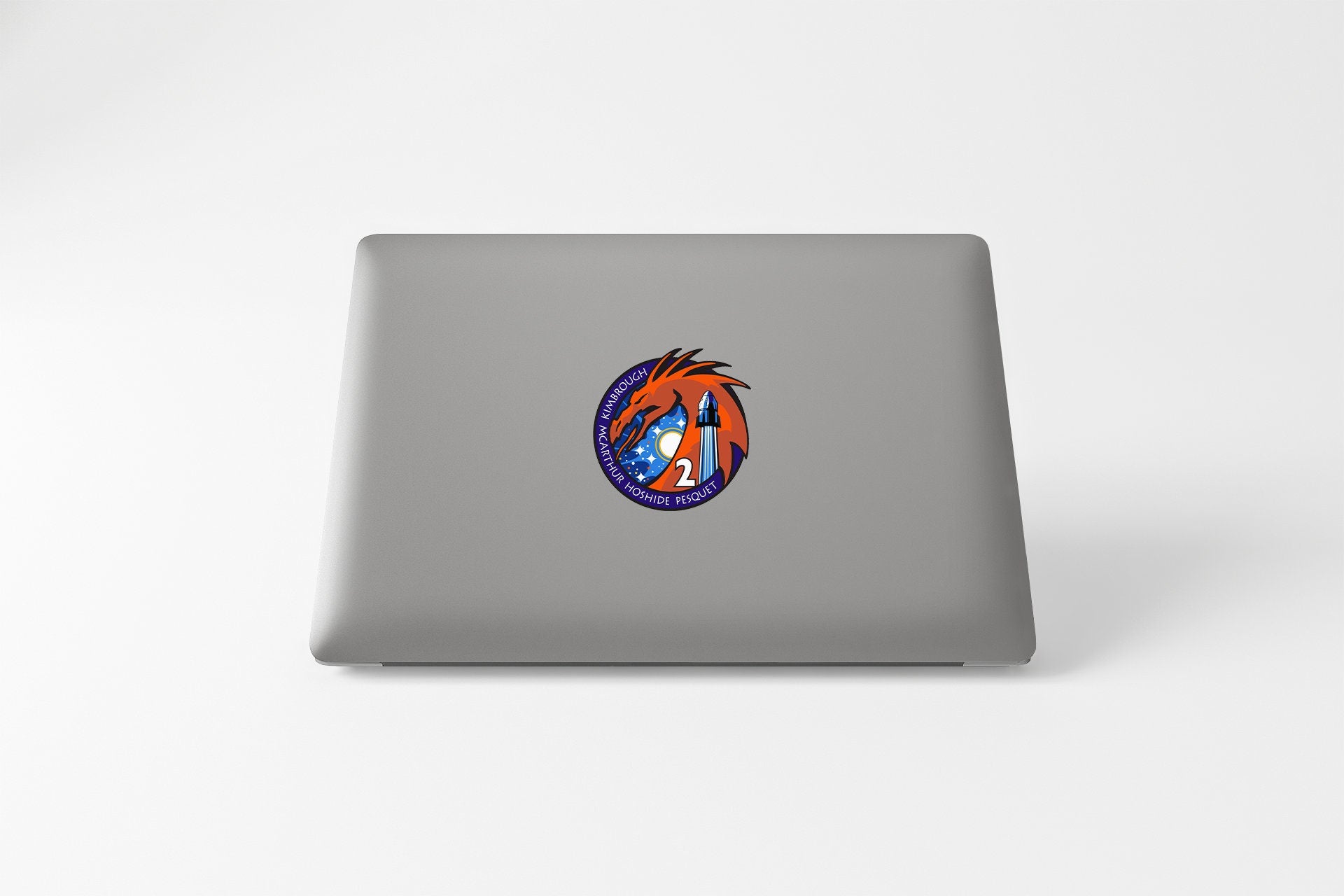 a laptop with a picture of a dragon on it