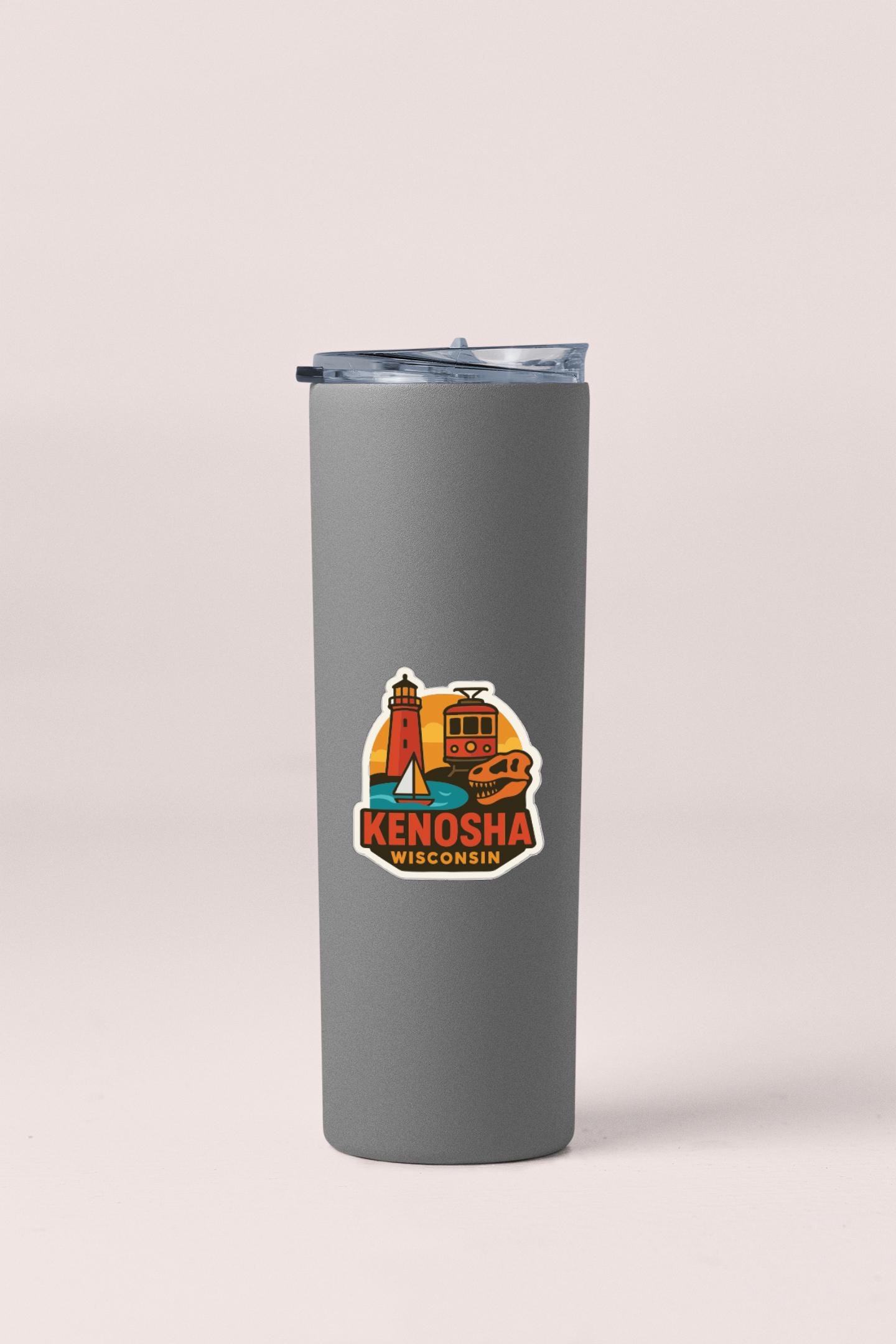 A gray insulated tumbler with a lid and a sticker featuring an illustration of landmarks and text.