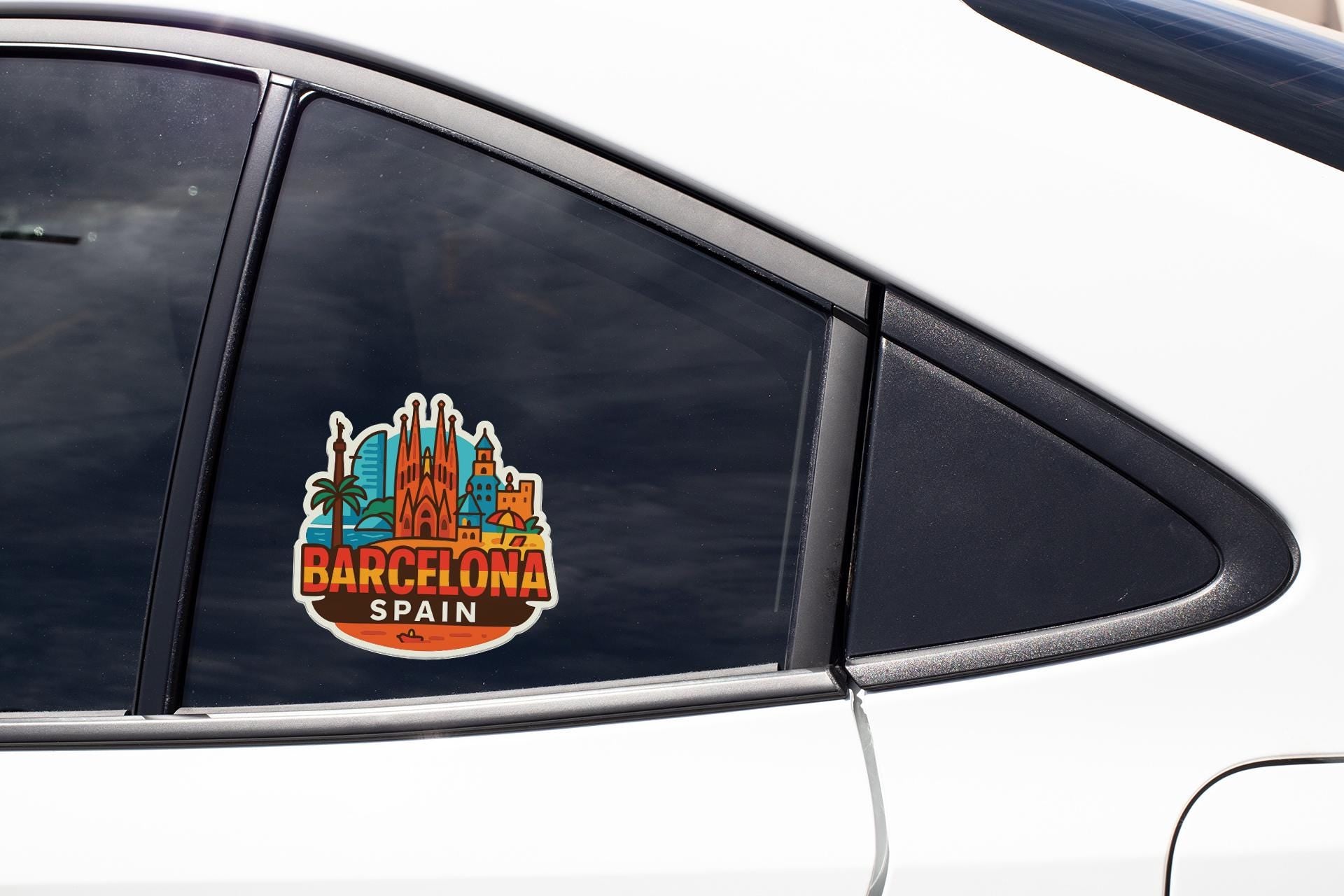 A sticker on the side of a car window, featuring the city of Barcelona, Spain.