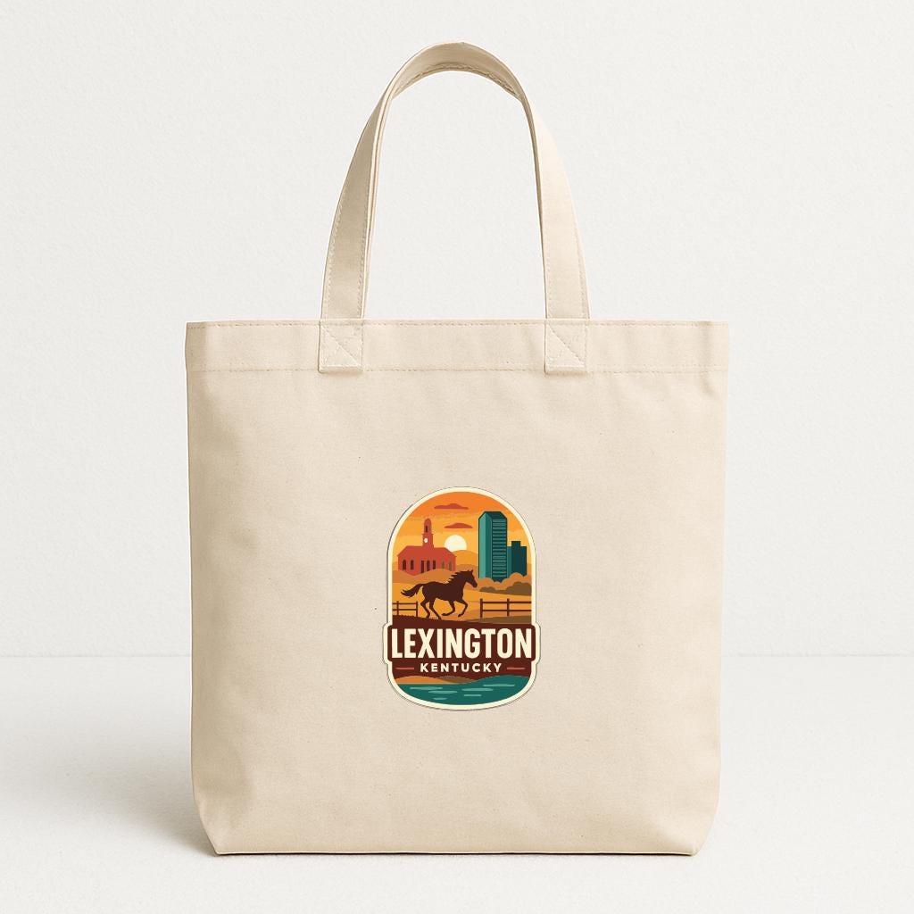 A beige tote bag with a graphic design featuring a horse and a sunset, along with the text "LEXINGTON KENTUCKY".