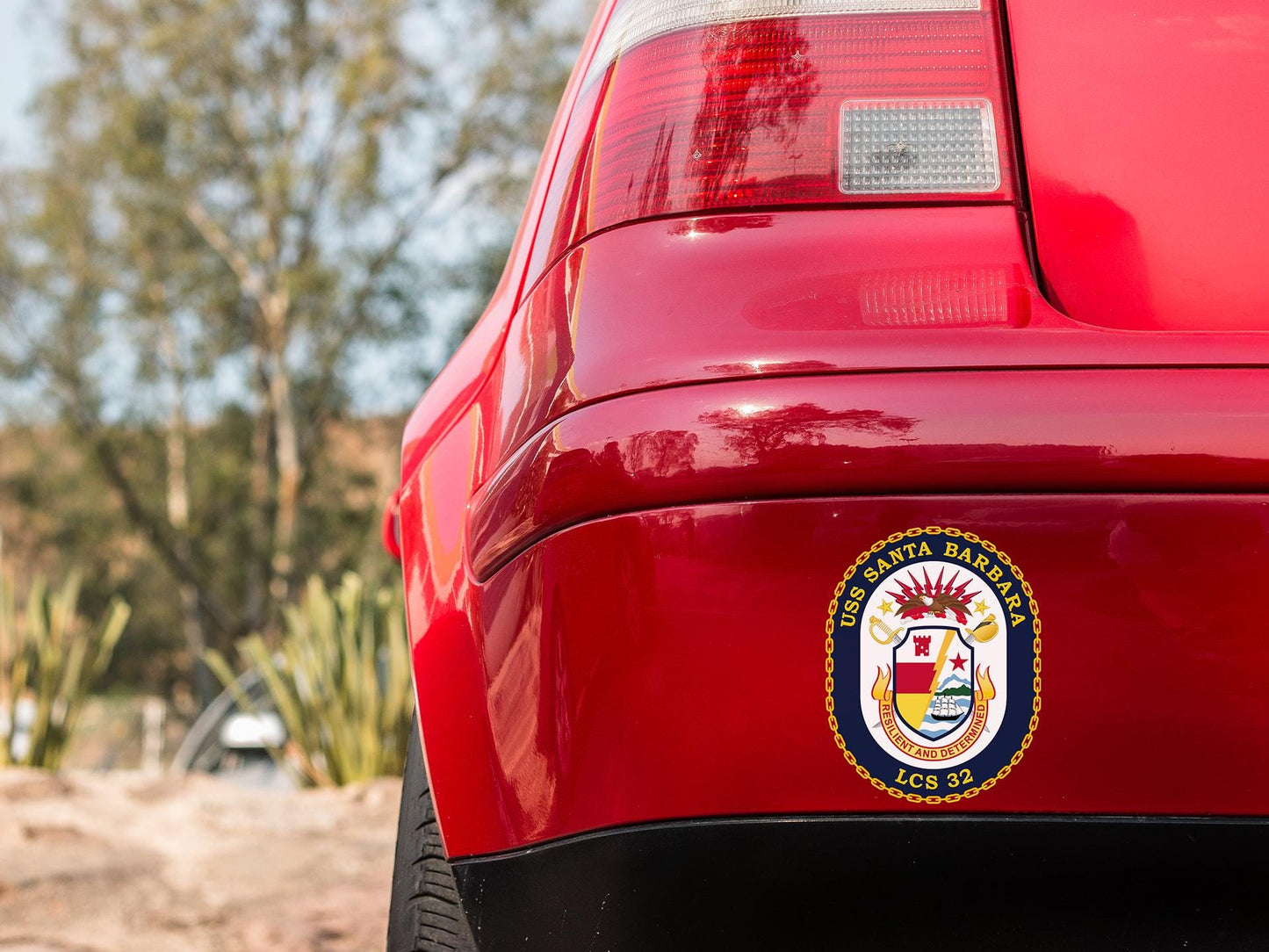 a close up of the emblem on a red car