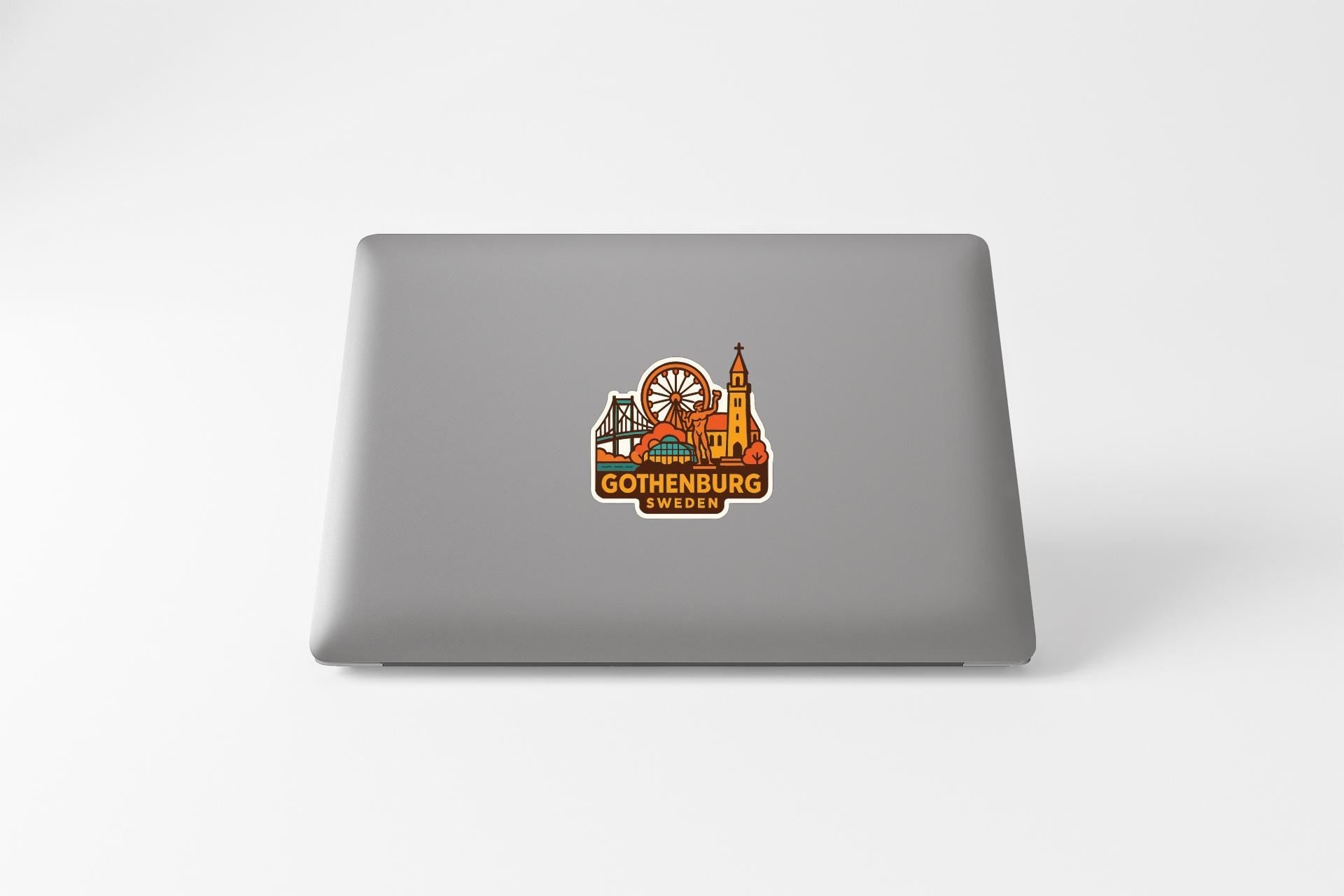 a sticker with a graphic of a city skyline and the text "GOTENBURG SWEDEN" on the back of a laptop.