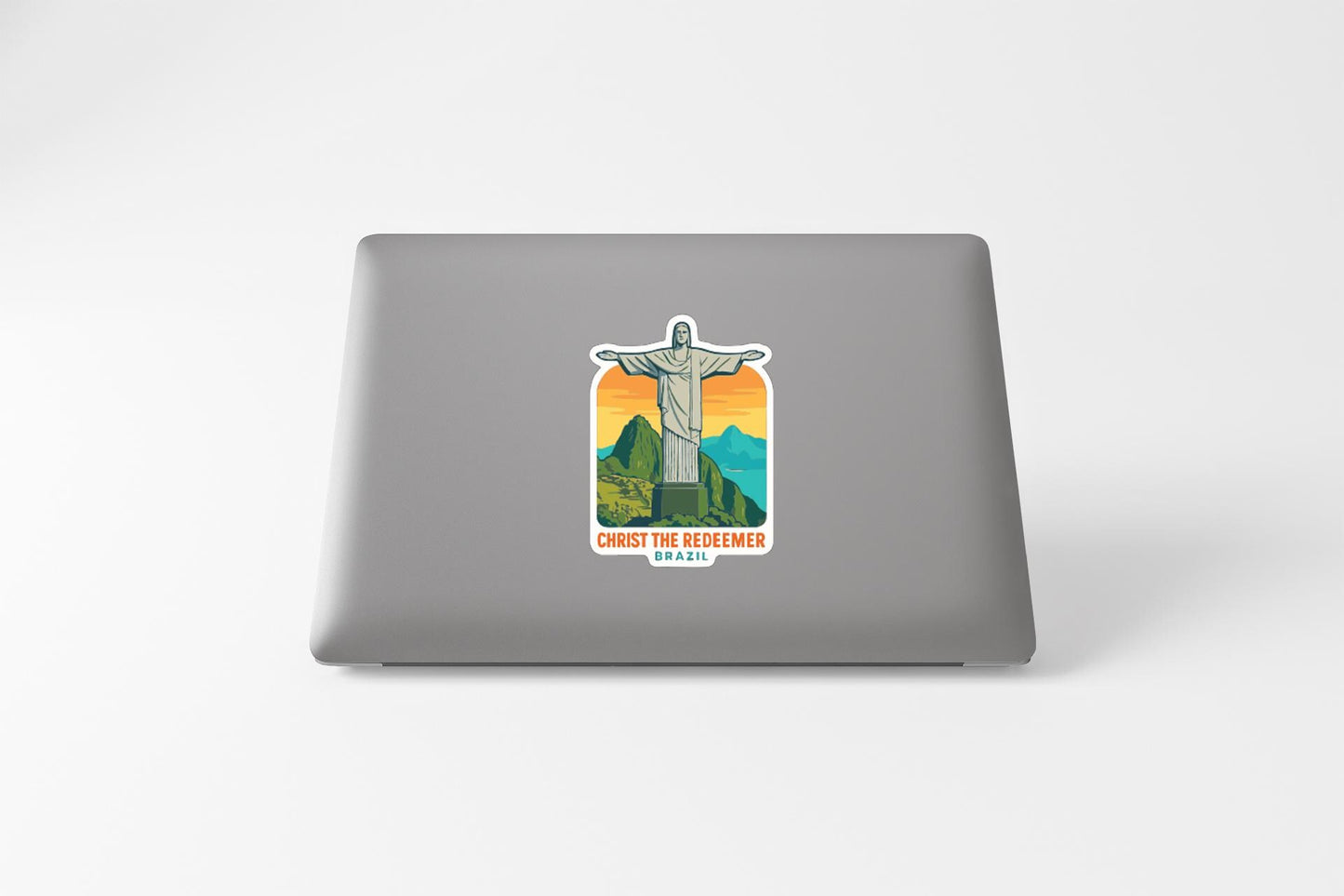 A sticker depicting the Christ the Reformer statue in a mountainous landscape.