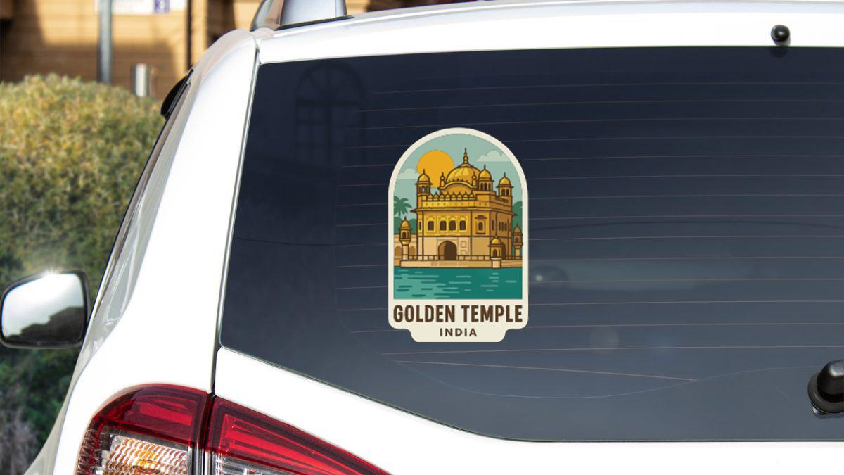 A sticker on the rear window of a car depicting the Golden Temple in India.