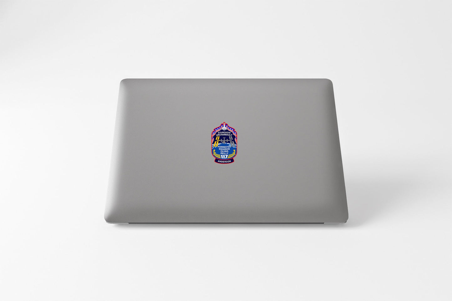 a laptop with a sticker of a hand holding a camera
