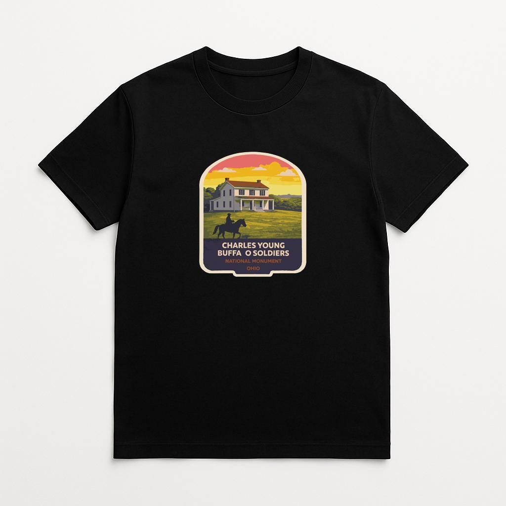 A black t-shirt with a graphic design depicting a house and a horse, along with text that reads "CHARLES YOUNG BUFFA O SOLDIERS".