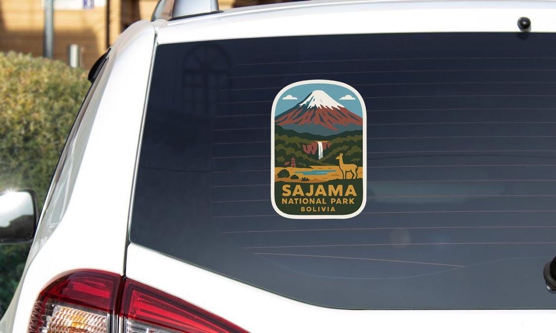 a sticker on the rear window of a white car, depicting a scenic landscape with a mountain and a waterfall.